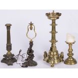 A lot comprising (4) bronze candlesticks, including one in Empire style, 19th/20th century.