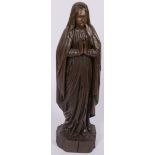 A carved nutwooden sculpture of a praying nun, France, 20th century.