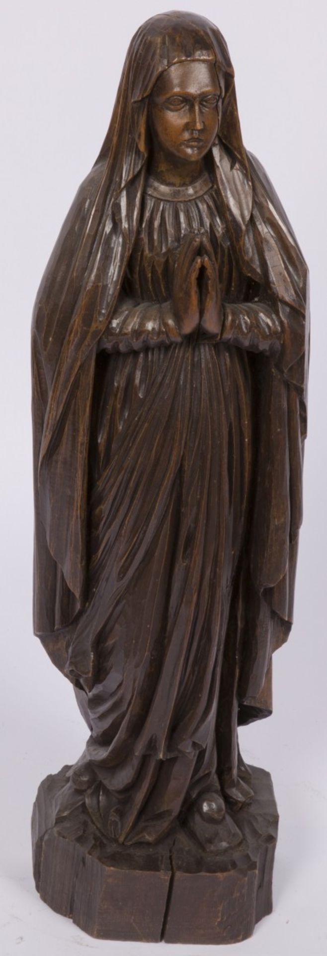 A carved nutwooden sculpture of a praying nun, France, 20th century.