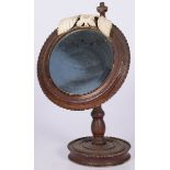 A round wood shaving mirror, Dutch, 3rd quarter 19th century.