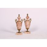 A set of (2) white marble Louis XVI-style ornamental chimney vases, 20th century.