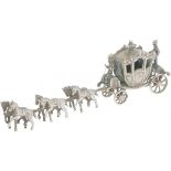 Miniature royal carriage with six horses of silver.
