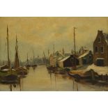 Adrianus Kuijpers (Gorkum 1862 - 1945 Amsterdam), View of a harbour in winter.