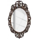 An oval nutwood Baroque mirror frame, Southern Europe, 20th century.