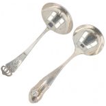 (2) piece lot of cream spoons silver.