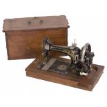 A sewing machine in its original case, Germany(?), ca. 1900.