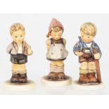 A lot comprising (3) Hummel figures.