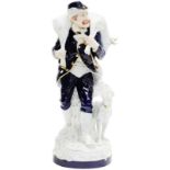 A porcelain figurine of a huntsman with his dog. Royal Dux Austria, 20th century.