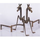 A pair of wrought iron fire dogs/ andirons, modelled with a dragons head and feet.