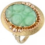 Yellow gold ring set with carved jade in oval setting - 14 ct.