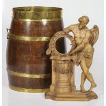A carved limewood clock case, together with a barrel, Dutch, 19th century and later.