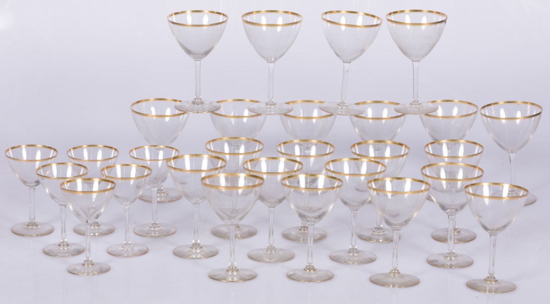 A lot comprising (28) gold rimmed coupes.