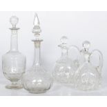 A lot of (4) various faceted glass stoppered bottles and decanters, 20th century.