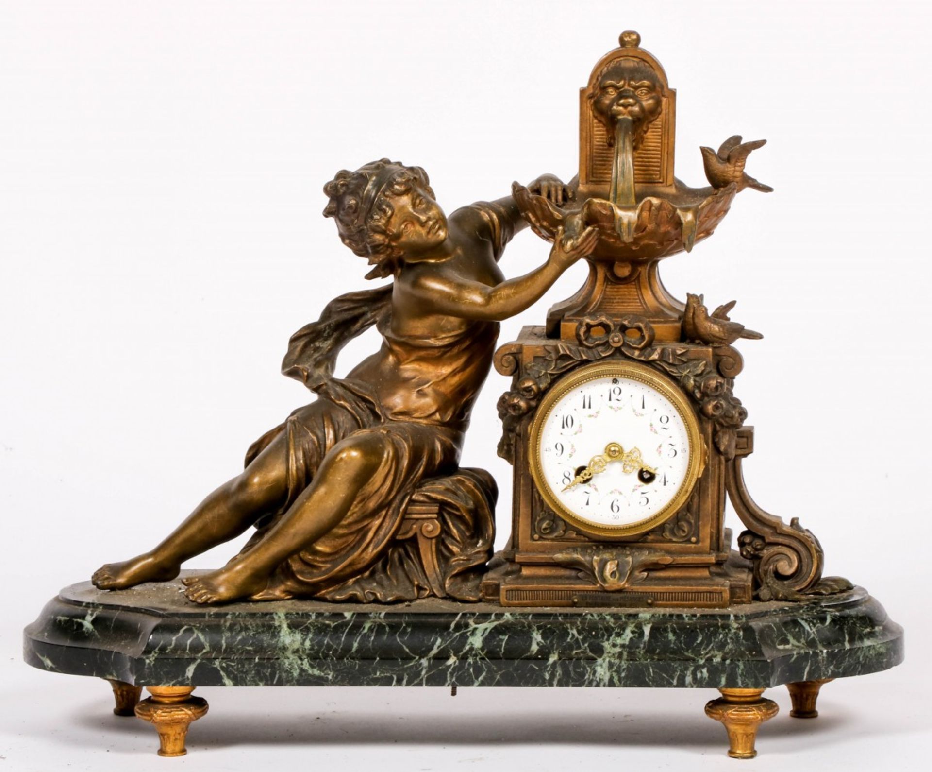 A ZAMAC chimey clock with a girl at a fountain, 20th century.