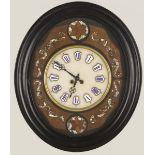 An oeil de boeuf clock, circa 1900.