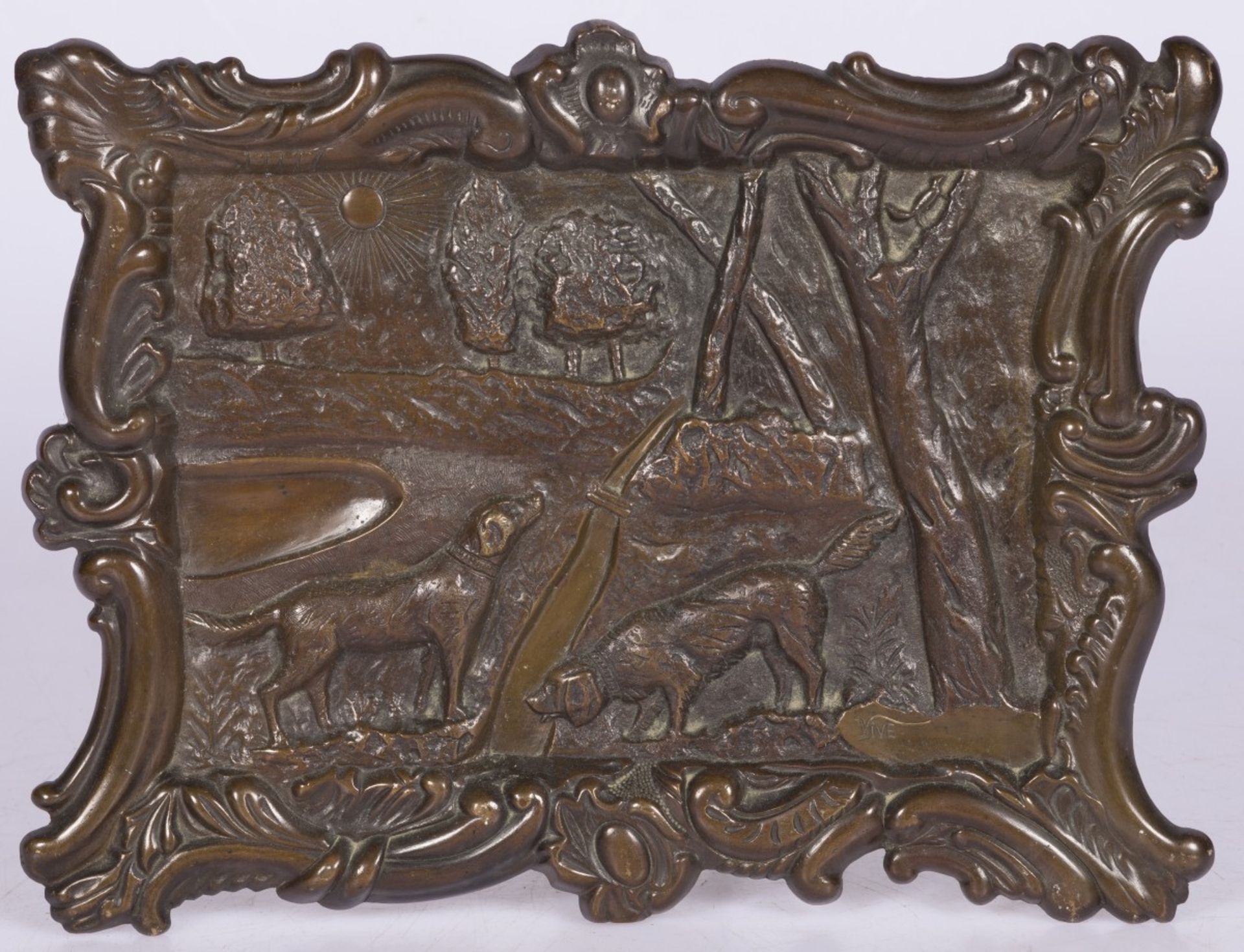 A bronze relief plaque depicting game hounds in a landscape, Germany, 20th century.