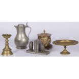 A lot with a cast brass tazza, a tobacco pot with lid, a candle stick, (2) pewter bookends and a dit