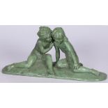 A ZAMAC sculpture of two whispering toddlers, France, 1st half 20th century.