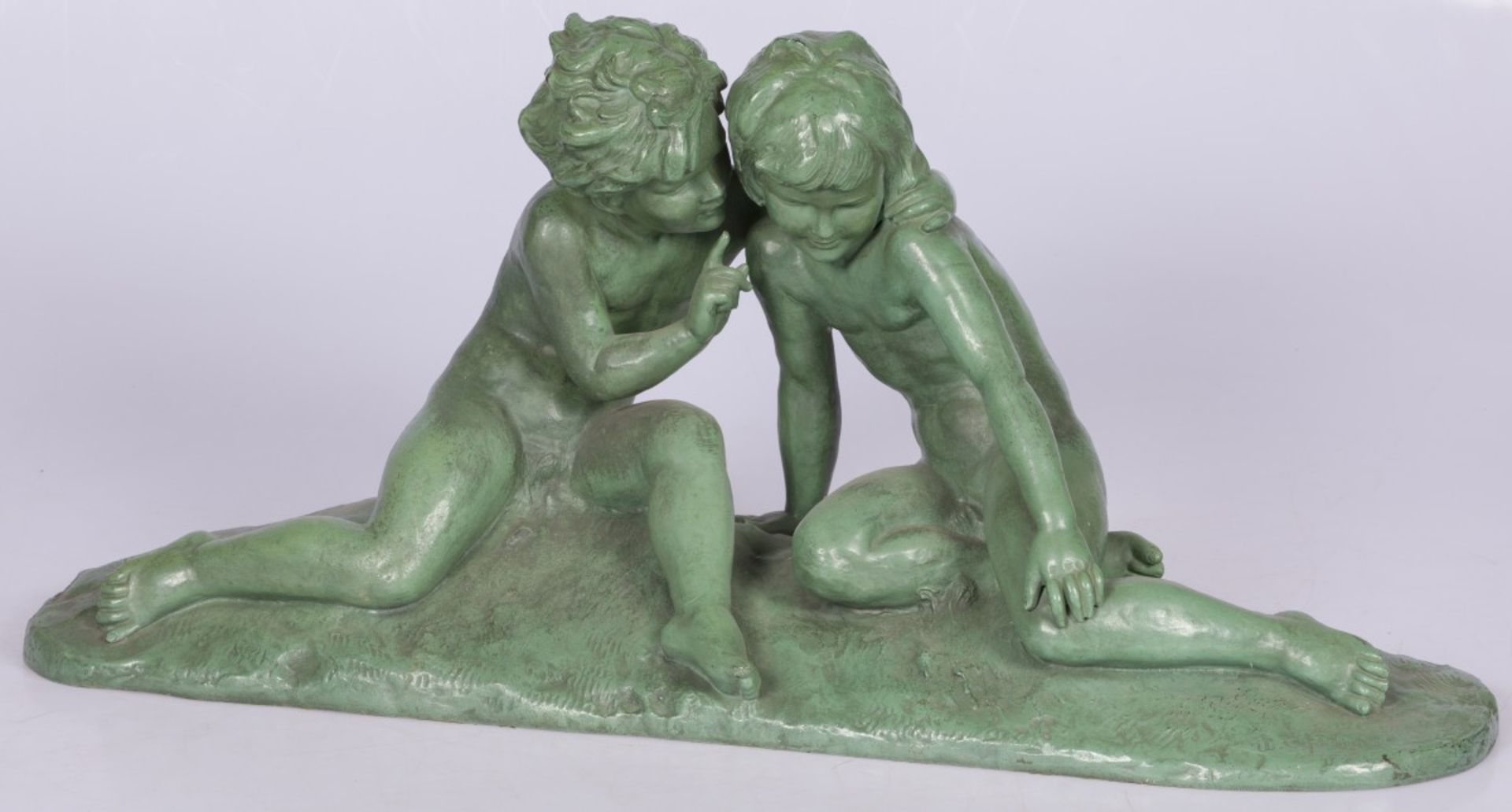 A ZAMAC sculpture of two whispering toddlers, France, 1st half 20th century.