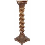 A carved wood pedestal in the shape of a column, 20th century.