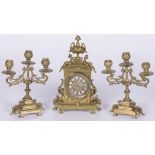 A brass neo-Louis XVI-style mantle piece set, France, 20th century.