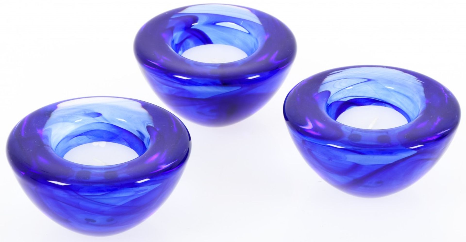 A lot with (3) cobalt glass "Ballo" votif candle-holders.