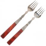 (2) piece set of silver meat forks.