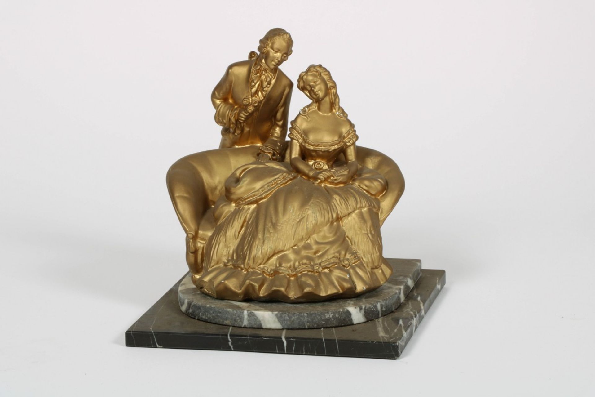 A gilt sculpture of a loving couple, 20th century.