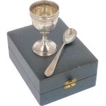 Egg cup with spoon in original silver pouch.