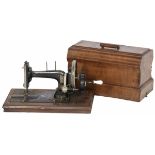 A sewing machine in wooden casing, 1st quarter of the 20th century.