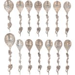 (14) piece set of teaspoons with sugar scoop and tea thumb silver.