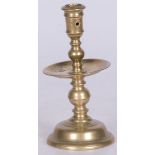 A bronze disc candle holder, late 18th century.