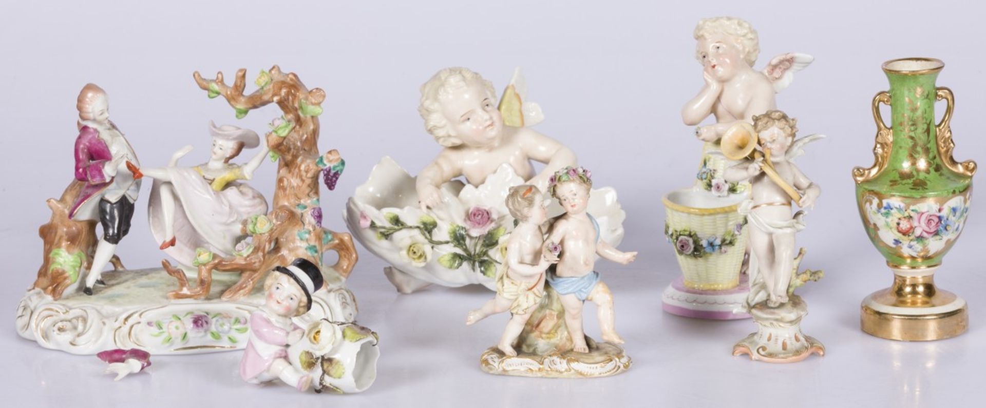 A lot of various porcelain items including a sculpture group of a man and woman in the forest, 20th 