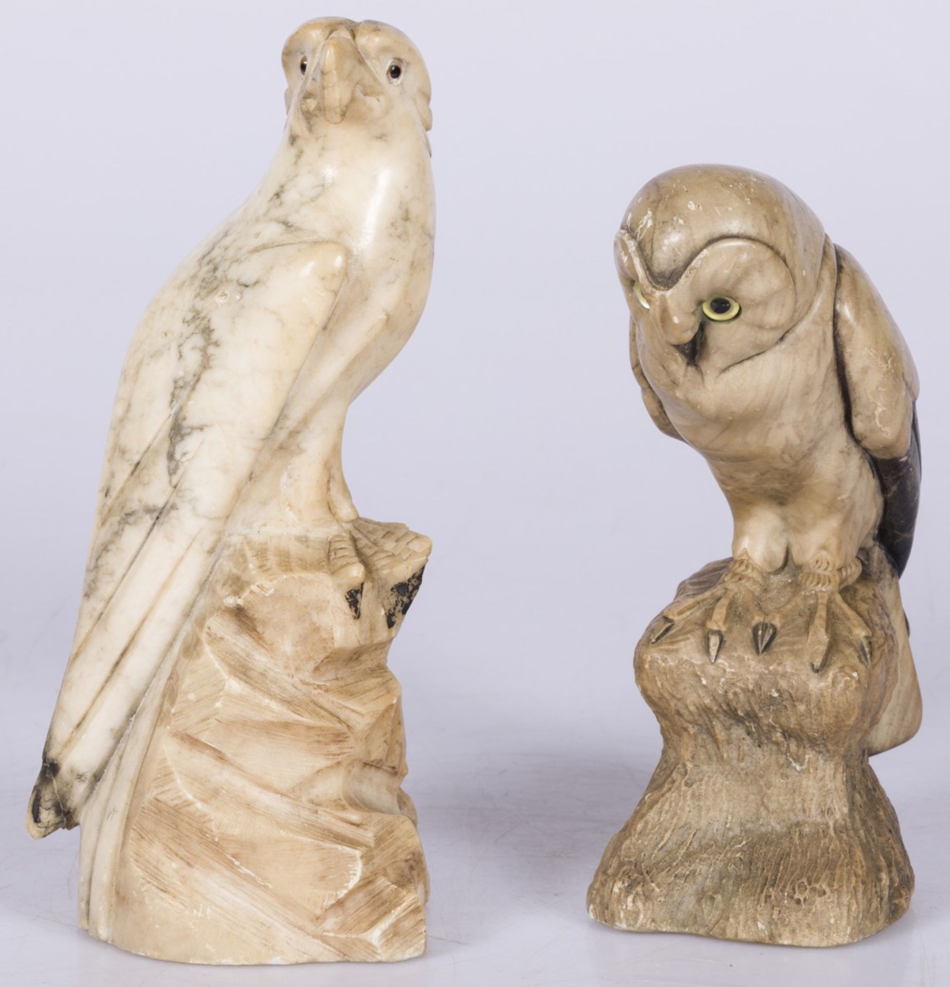 A lot comprising (2) marble sculptures of an eagle and an owl.