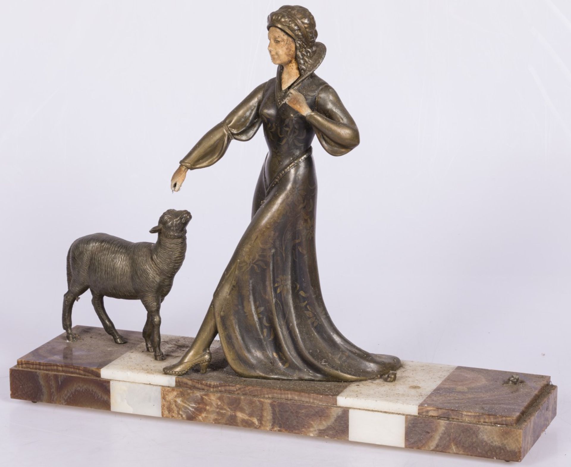 A ZAMAC sculpture of a lady with a sheep, Italy, 2nd quarter 20th century.