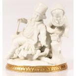 A porcelain group of a man and woman. With guilded rim at the foot.
