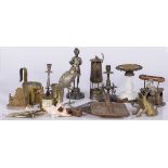 A lot of miscellaneous items including a miner's lamp and various sculptures.