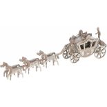 Miniature royal carriage with six horses in silver.