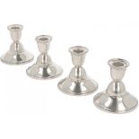 (4) piece set of silver table candlesticks.