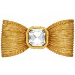 Large gold tone vintage Yves Saint Laurent Rive Gauche bow brooch set with clear crystal.