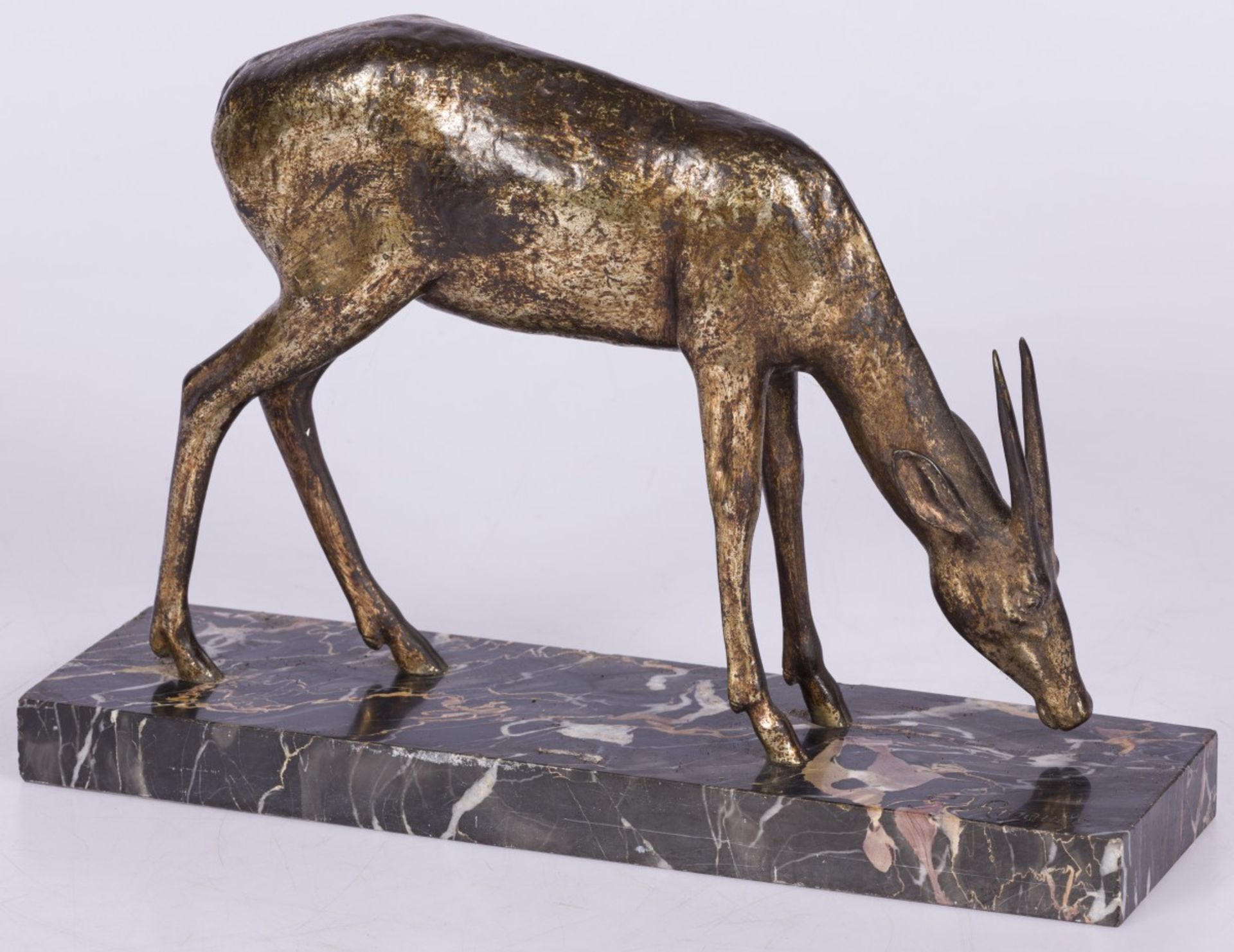 A bronze sculpture of a grazing gazelle, France, 2nd quarter 20th century.