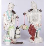 A set of (2) porcelain Asian figures with yoke on the shoulders, 20th century.