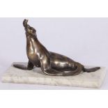 A bronze sculpture of a seal with fish in its beak, France, 2nd quarter 20th century.