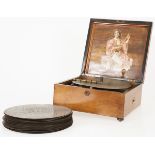 A Kalliope disc music box with records. Circa 1900.