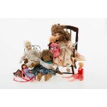 A lot mscelaneous comprising of (6) dolls, clothing, (2) chairs.