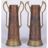 A set of copper 'Arts & Crafts' - style chased copper vases