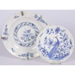 A lot comprised of (2) various Delft chargers with blue and white motifs, Dutch, 19th century and la