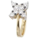 Bicolor gold ring set with approx. 0.44 ct. white and black diamond in a flower-shaped setting - 18