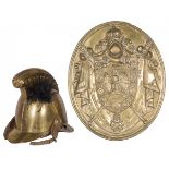 A copper firefighters helmet together with a copper wall plaque, France, ca. 1900.