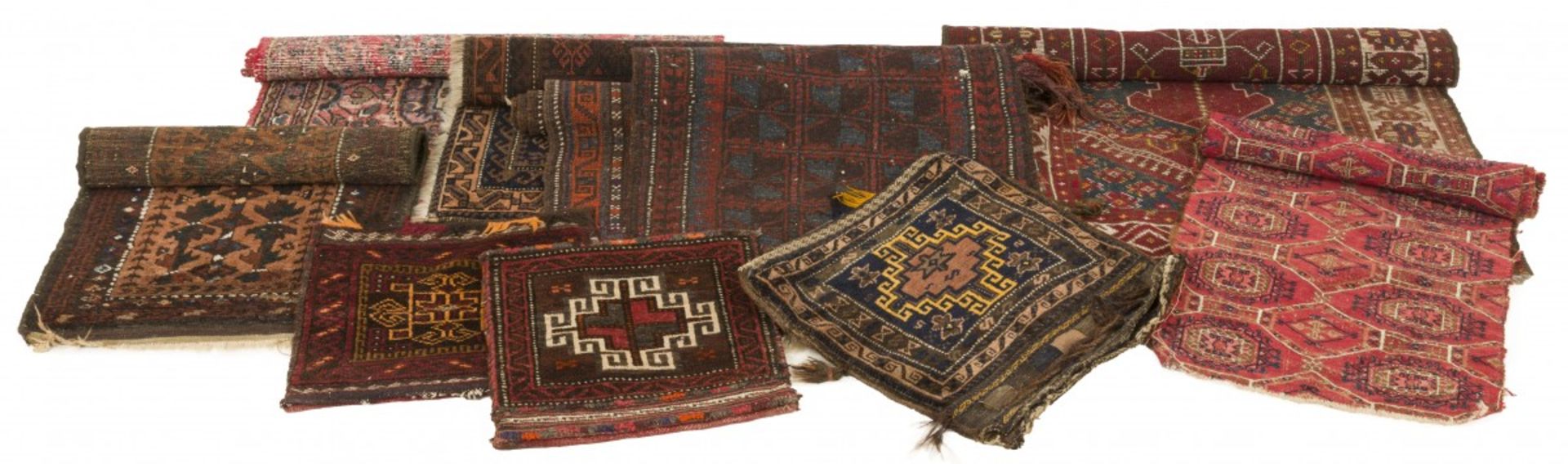 A lot comprised of (10) various carpets and pillowcases, 20th century.